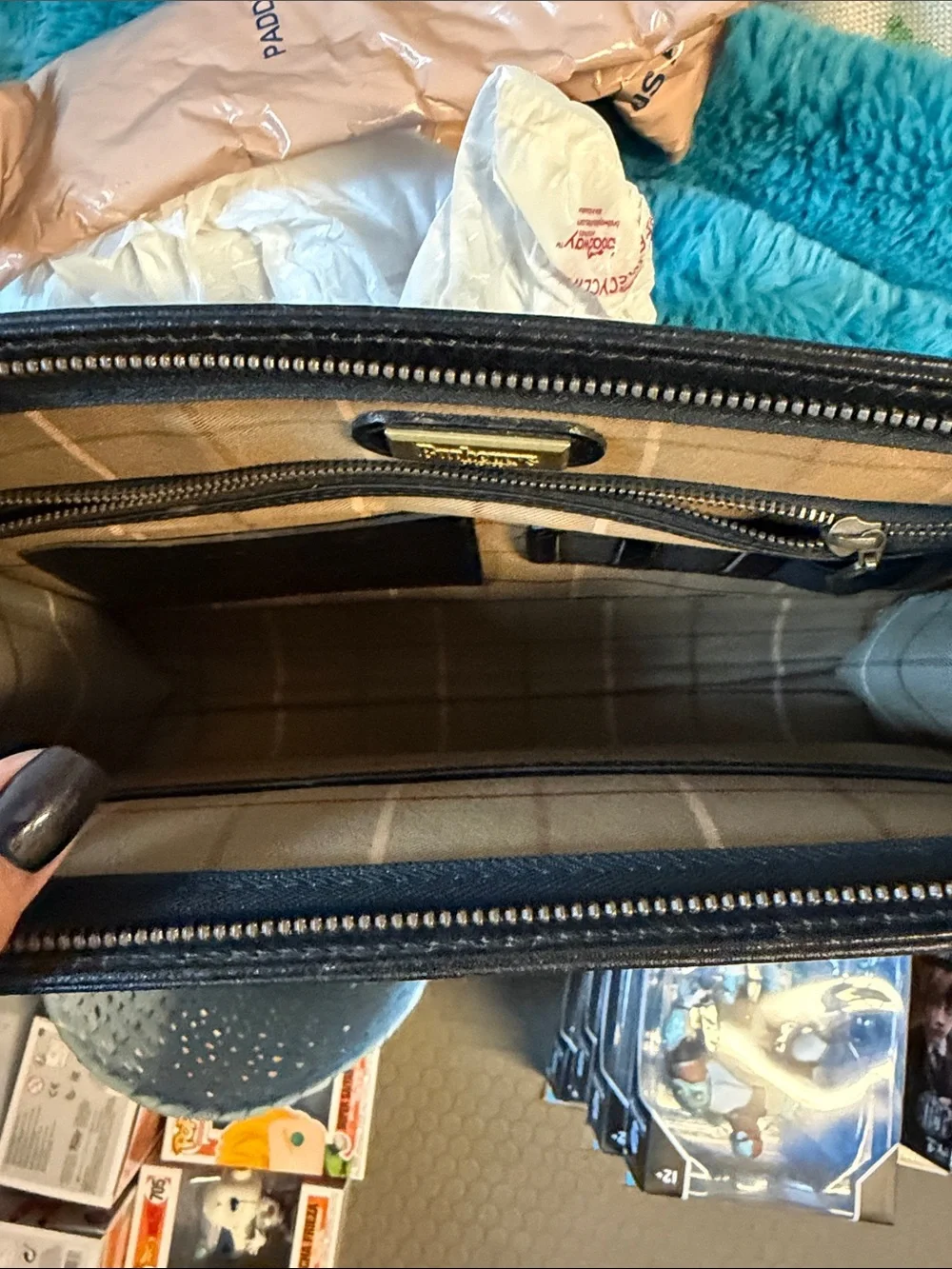 Burberry’s Wristlet or Planner